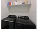 Laundry room with washer, dryer, and shelving at 1010 Tidewater Shores Loop # 103, Bradenton, FL 34208