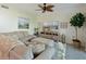 Comfortable living room with sectional sofa and large TV at 1010 Tidewater Shores Loop # 103, Bradenton, FL 34208