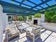 Relaxing outdoor patio with fireplace and seating at 1010 Tidewater Shores Loop # 103, Bradenton, FL 34208