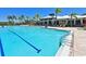 Community pool with a lap lane and lounging area at 1010 Tidewater Shores Loop # 103, Bradenton, FL 34208