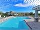 Relaxing community pool with lounge chairs at 1010 Tidewater Shores Loop # 103, Bradenton, FL 34208