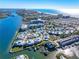 Aerial view of waterfront community, showing home location, pool, and marina at 1325 Siesta Bayside Dr # 1325B, Sarasota, FL 34242