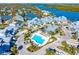 Aerial view showing community pool and surrounding buildings at 1325 Siesta Bayside Dr # 1325B, Sarasota, FL 34242
