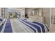 Spacious bedroom with a king-size bed and direct access to a private balcony at 1325 Siesta Bayside Dr # 1325B, Sarasota, FL 34242
