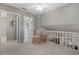 Upper hallway with a seating area, built-in shelves, and a view of a bathroom at 1325 Siesta Bayside Dr # 1325B, Sarasota, FL 34242