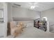 Upper hallway with seating area, built-in bookshelves, and access to bathroom at 1325 Siesta Bayside Dr # 1325B, Sarasota, FL 34242