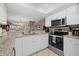 Kitchen with granite countertops and stainless steel appliances at 1325 Siesta Bayside Dr # 1325B, Sarasota, FL 34242