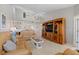 Living room with a large TV, comfortable seating, and high ceilings at 1325 Siesta Bayside Dr # 1325B, Sarasota, FL 34242