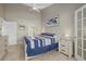 Main bedroom with a king-size bed and en-suite bathroom at 1325 Siesta Bayside Dr # 1325B, Sarasota, FL 34242