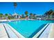 Inviting community pool with surrounding lounge chairs at 1325 Siesta Bayside Dr # 1325B, Sarasota, FL 34242