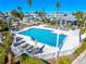 Community pool with lounge chairs and patio area at 1325 Siesta Bayside Dr # 1325B, Sarasota, FL 34242
