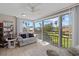 Sunroom with water views and comfortable seating at 1325 Siesta Bayside Dr # 1325B, Sarasota, FL 34242