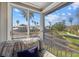 Sunroom offering scenic water views and comfortable seating at 1325 Siesta Bayside Dr # 1325B, Sarasota, FL 34242