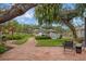 Brick patio with fire pit, overlooking the pool and canal at 1827 Baywood Dr, Sarasota, FL 34231