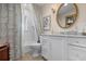 Elegant bathroom with white cabinets, marble vanity, and patterned shower curtain at 1827 Baywood Dr, Sarasota, FL 34231