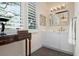 Bright bathroom with white vanity, large mirror, and natural light at 1827 Baywood Dr, Sarasota, FL 34231