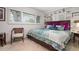 Spacious bedroom with a queen-size bed and built-in shelving at 1827 Baywood Dr, Sarasota, FL 34231