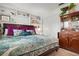Relaxing bedroom with a large bed, built-in shelves, and a wooden cabinet at 1827 Baywood Dr, Sarasota, FL 34231