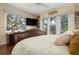 Bright bedroom with a king-size bed and French doors leading to a patio at 1827 Baywood Dr, Sarasota, FL 34231
