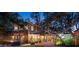 Two-story house exterior with backyard and lighting at 1827 Baywood Dr, Sarasota, FL 34231