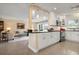 Modern kitchen with white shaker cabinets and breakfast bar at 1827 Baywood Dr, Sarasota, FL 34231