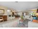 Open living area with white sofas, a coffee table, and a view into the dining room and kitchen at 1827 Baywood Dr, Sarasota, FL 34231