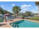 Enjoy the sunny days by the pool with a deck overlooking the canal at 1827 Baywood Dr, Sarasota, FL 34231