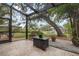 Relaxing screened patio overlooking backyard oasis with pool and lush landscaping at 1827 Baywood Dr, Sarasota, FL 34231