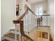Elegant wooden staircase with white railings leading to the upper level at 1827 Baywood Dr, Sarasota, FL 34231