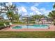 Inviting kidney-shaped pool with brick deck and waterfront views at 1827 Baywood Dr, Sarasota, FL 34231
