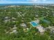 Aerial view showing community features including pool, tennis courts, and neighborhood at 2343 Prospect St, Sarasota, FL 34239