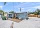 Backyard with gravel ground cover, a patio, and a wooden fence at 2343 Prospect St, Sarasota, FL 34239