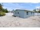 House exterior and backyard with gravel at 2343 Prospect St, Sarasota, FL 34239