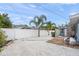 Backyard with gravel, a patio, and palm trees at 2343 Prospect St, Sarasota, FL 34239