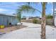 Backyard with gravel, a patio, and a palm tree at 2343 Prospect St, Sarasota, FL 34239