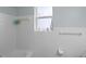 Clean bathroom with white tiled walls and a bathtub at 2343 Prospect St, Sarasota, FL 34239