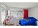 Small bedroom with white dresser and blue bedding at 2343 Prospect St, Sarasota, FL 34239