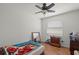 Bright bedroom with floral bedspread and wood dresser at 2343 Prospect St, Sarasota, FL 34239