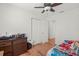 Bright bedroom featuring wood flooring and a double door closet at 2343 Prospect St, Sarasota, FL 34239