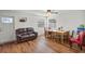 Bright dining area with hardwood floors, wooden table, and leather couch at 2343 Prospect St, Sarasota, FL 34239