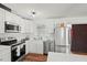 Modern white kitchen with stainless steel appliances at 2343 Prospect St, Sarasota, FL 34239