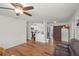 Open living room with kitchen views, hardwood floors, and leather couch at 2343 Prospect St, Sarasota, FL 34239