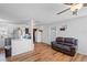 Open living room with a modern kitchen, and dark brown couch at 2343 Prospect St, Sarasota, FL 34239