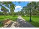 Park with a walking path, bench, pond, and fountain at 2343 Prospect St, Sarasota, FL 34239