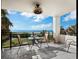 Balcony with ocean view, seating, and sunny atmosphere at 4241 Gulf Of Mexico Dr # 202, Longboat Key, FL 34228