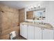 Spa-like bathroom with double vanity and a bathtub at 4241 Gulf Of Mexico Dr # 202, Longboat Key, FL 34228