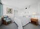 Bedroom with a full-size bed and a sitting chair at 4241 Gulf Of Mexico Dr # 202, Longboat Key, FL 34228