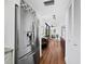 Stainless steel refrigerator and hardwood floors in kitchen at 4241 Gulf Of Mexico Dr # 202, Longboat Key, FL 34228