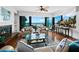 Living room with ocean view, fireplace, and comfy seating at 4241 Gulf Of Mexico Dr # 202, Longboat Key, FL 34228