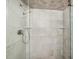 Walk-in shower with tiled walls and a glass enclosure at 4241 Gulf Of Mexico Dr # 202, Longboat Key, FL 34228